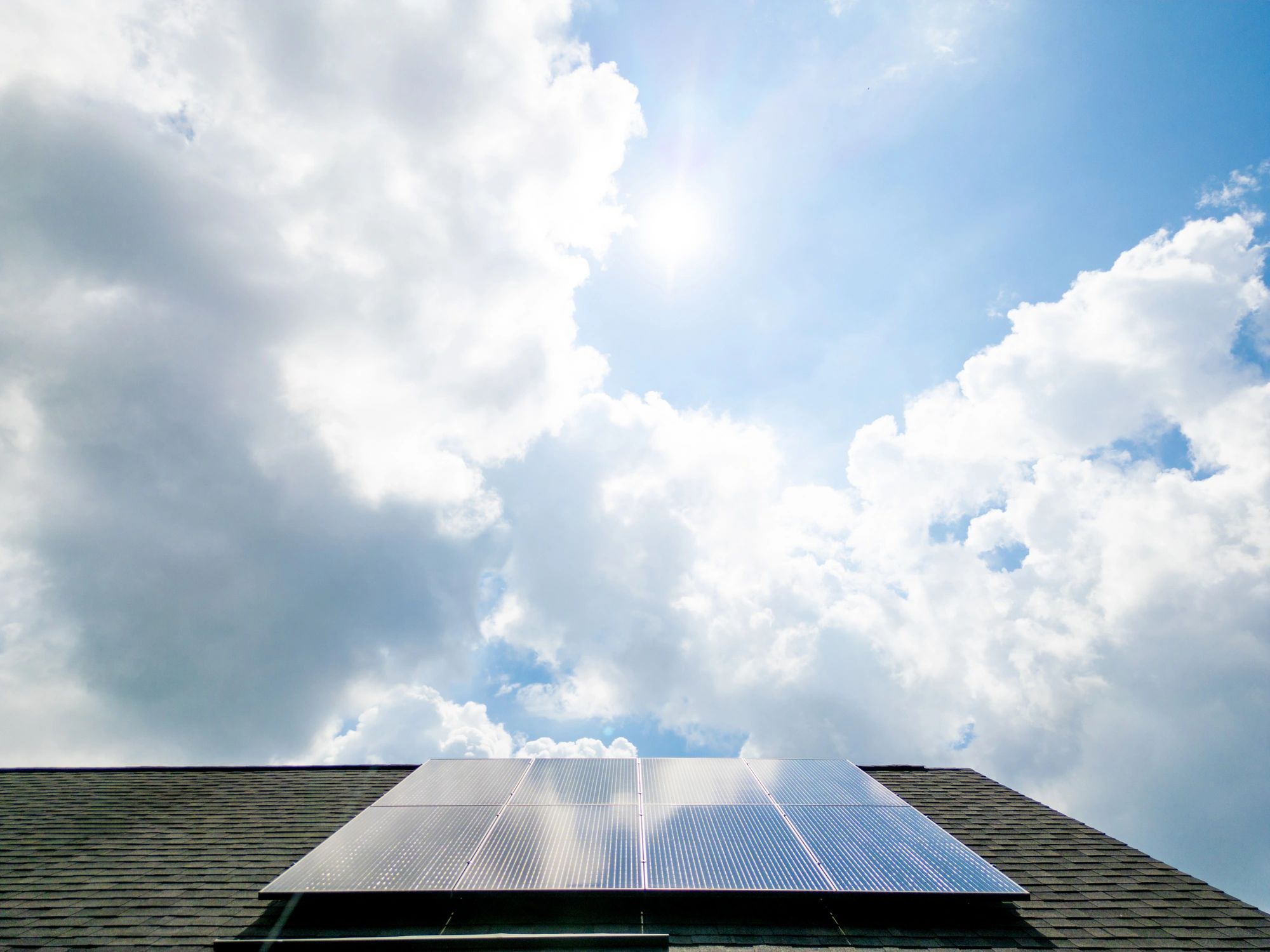 Home with rooftop solar panels for residential battery integration