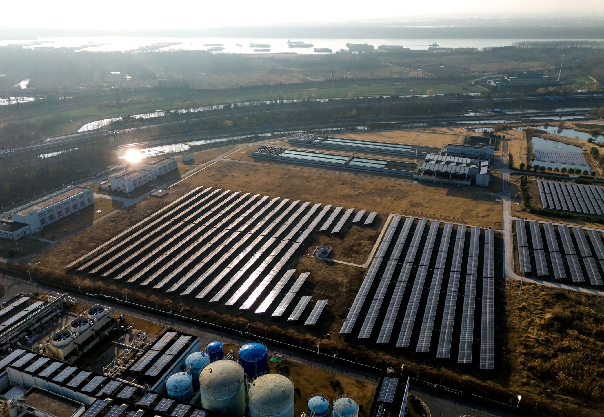 Aerial view of solar panels on a grassy field